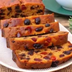 Grandma's traditional fruit cake recipe showing two golden loaves with rich fruit filling