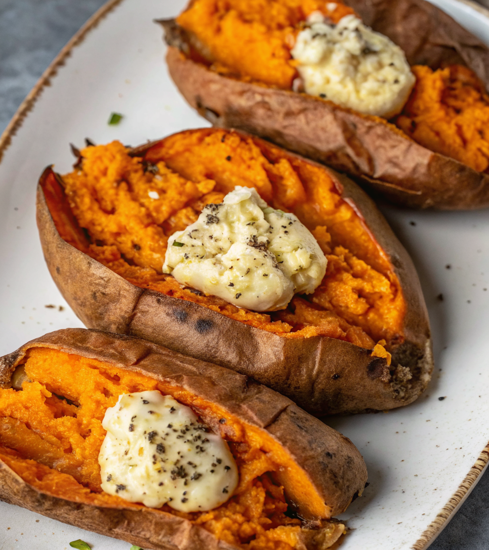 Traeger Smoked Sweet Potatoes with Roasted Garlic Butter